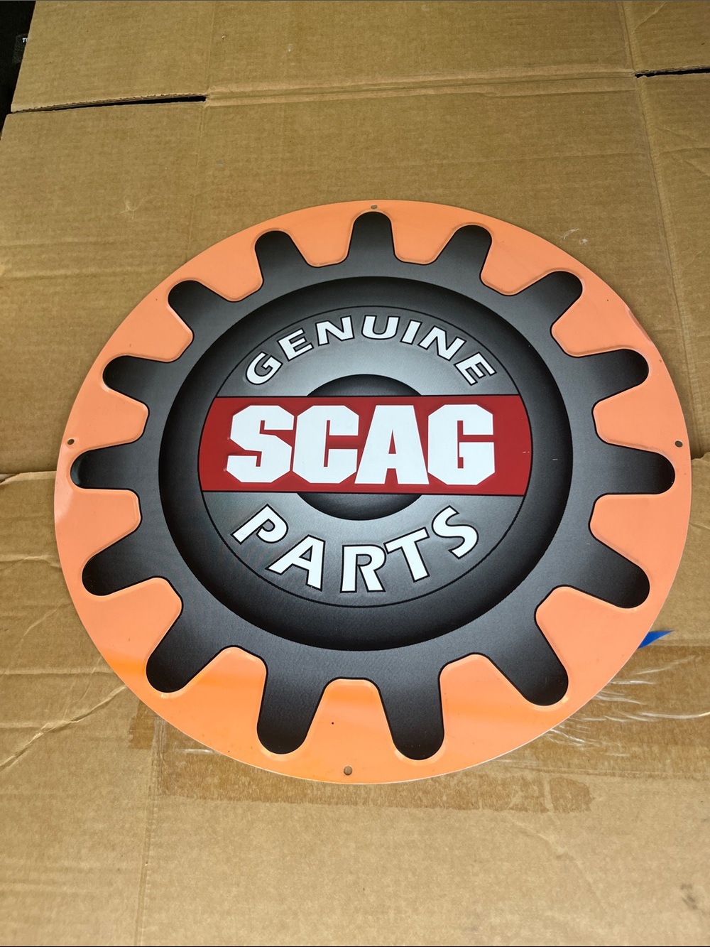 SCAG Genuine Parts Round Metal Sign - Orange & Black